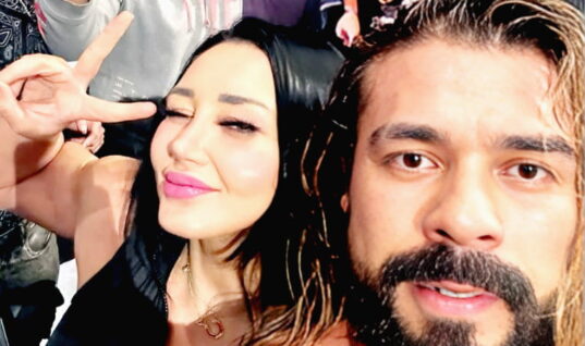 Mystery Ringside “Fan” Revealed After Andrade Selfie & Number Swap